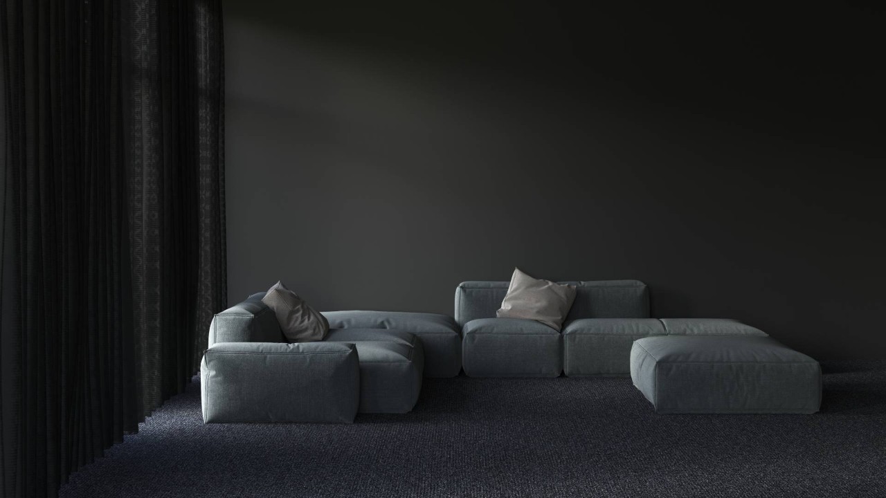 A darkened living room with sheer curtains and room-darkening window treatments at All About Blinds, Etc. near O'Fallon, Missouri